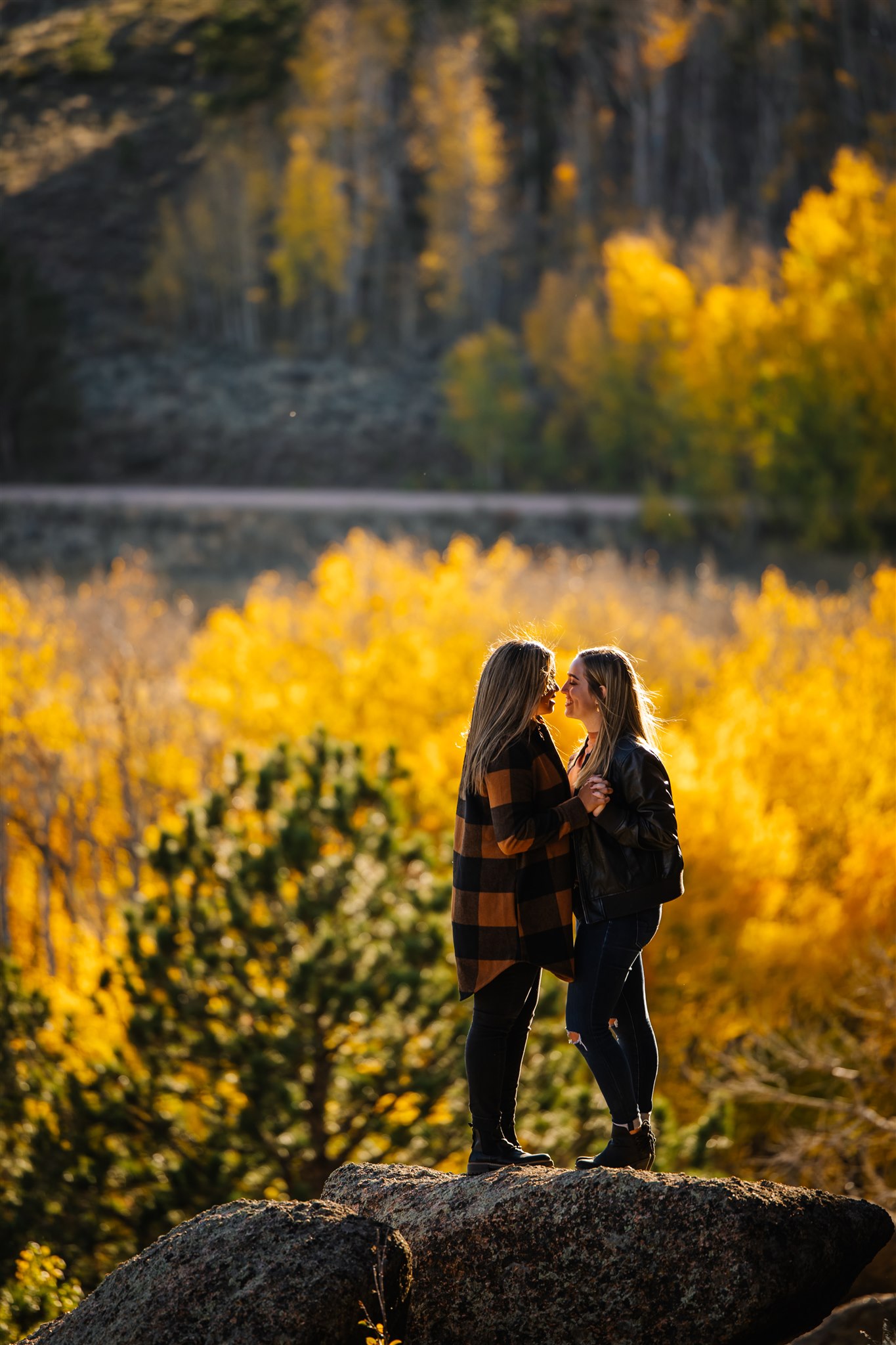 Sae sex fall engagement photo in Wyoming mountains.